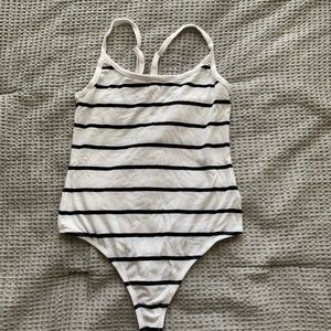 White and Black bodysuits.